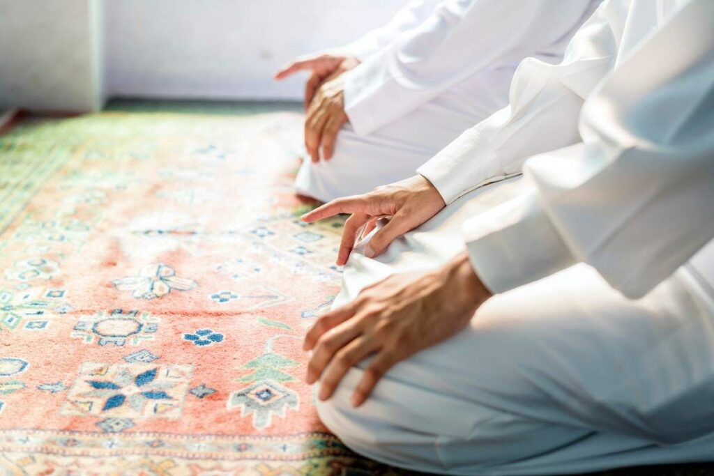 Man praying before exercising during Ramadan.